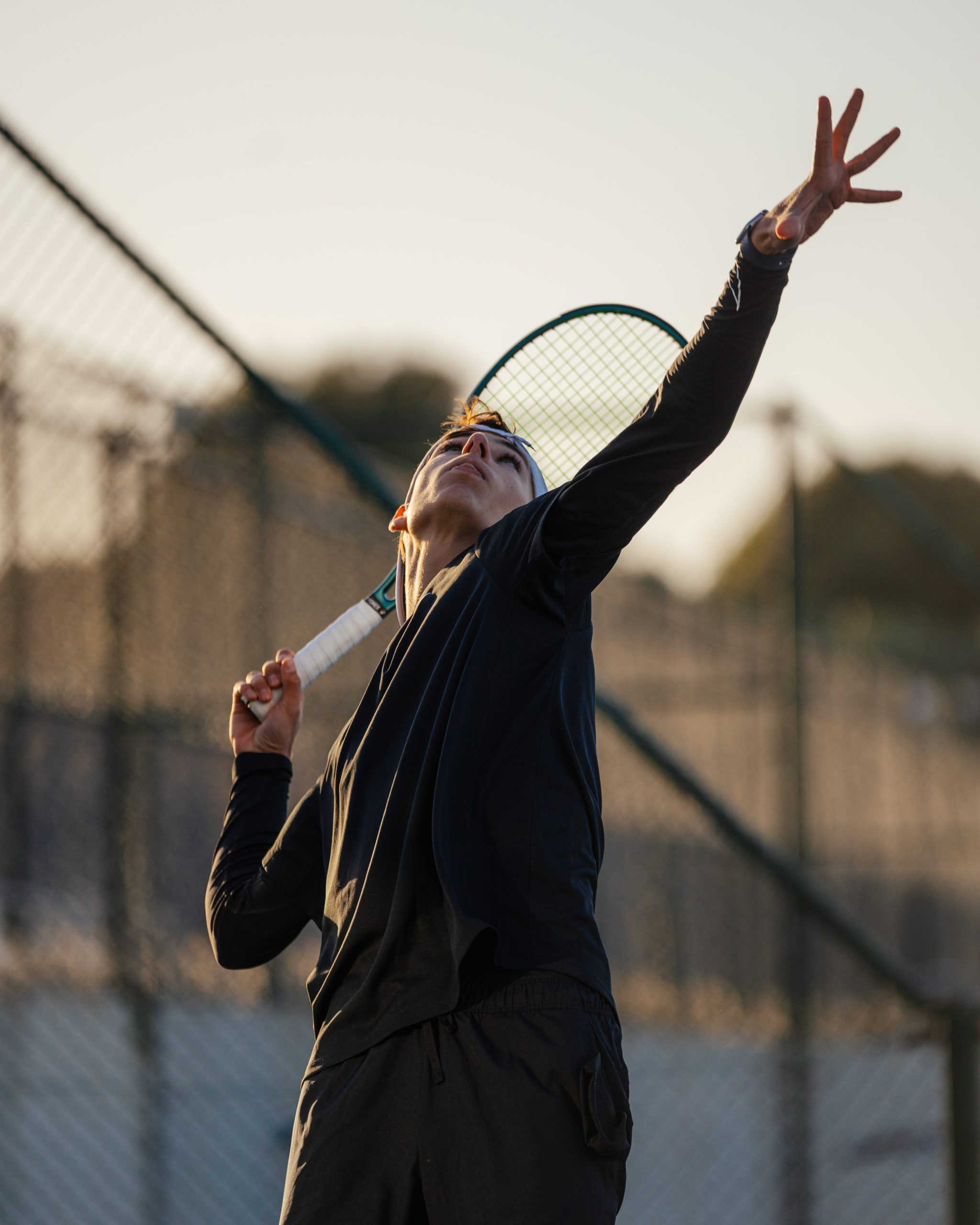 Junior player serving